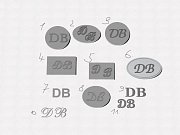 Set manžetových knoflíčků a spon na kravatu s rytinou monogramu DB vyrobené na zakázku